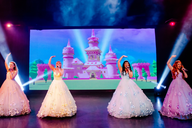 Image showing Pop Princesses on the stage dressed in beautiful gowns.